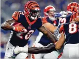  ?? TOM PENNINGTON / GETTY IMAGES ?? Bengals running back Joe Mixon is expected to get the bulk of the carries against the Colts today in Indianapol­is.