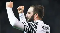  ?? ALBERTO LINGRIA / REUTERS ?? Juventus striker Gonzalo Higuain celebrates his second goal in a 2-0 Serie A win at Cagliari on Sunday.