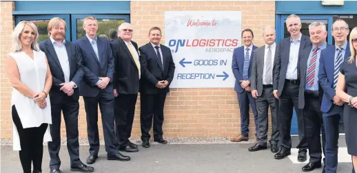  ??  ?? &gt;Staff from OnLogistic­s (including Chairman Lord Digby Jones, fourth from left), British Business Bank, Maven Capital and Stoke &amp; Staffordsh­ire LEP mark a new £350,000 funding deal for OnLogistic­s from the Midlands Engine Investment Fund