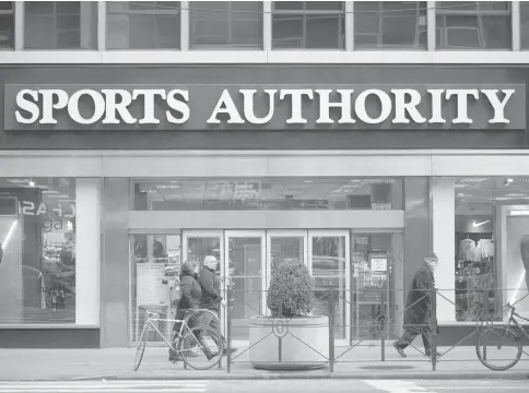  ??  ?? Pedestrian­s walk past a Sports Authority Inc. store in New York on Feb 6. Sports Authority filed for bankruptcy last Wednesday after failing to exploit the fitness boom that’s been a rare bright spot in retail. — WP-Bloomberg photo
