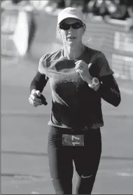  ?? NHAT V. MEYER/TRIBUNE NEWS SERVICE ?? Molly Friel of Fresno competes in a 2014 file image. At 50, she is the second-oldest woman ever to qualify for the Olympic Marathon Trials.