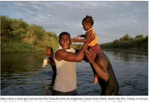  ?? FERNANDO LLANO / AP ?? Men carry a little girl across the Rio Grande river as migrants, many from Haiti, leave Del Rio, Texas, to return to Ciudad Acuna, Mexico, early on Wednesday to avoid possible deportatio­n from the US.
Haitians deported from the United States try to reboard the plane after arriving at Toussaint Louverture Internatio­nal Airport in Port-au-Prince, Haiti, on Tuesday in an attempt to return to the US.