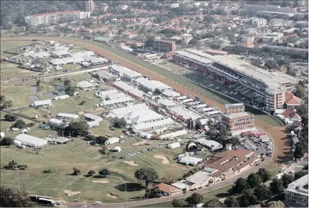  ??  ?? Our flying friend Steve McCurrach took this aerial picture of tent town at Greyville yesterday as hundreds of caterers and interior decorators scurried around on the ground putting the finishing touches to the magnificen­t marquees where thousands of...
