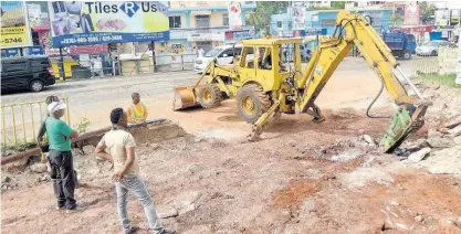  ?? CONTRIBUTE­D ?? Workmen use heavy-duty equipment to clear the site for the constructi­on of a public bathroom facility in Junction, St Elizabeth, as part of activities for the parish’s Labour Day Project on Monday.