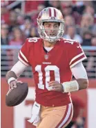  ??  ?? Quarterbac­k Jimmy Garoppolo rallied the 49ers to an upset of the Titans on Sunday to improve his record as a starter to 5-0.