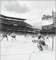  ?? GARY HERSHORN/ REUTERS ?? New York’s Henrik Lundqvist plays the puck during the NHL Winter Classic game in Philadelph­ia last Jan. 2.