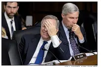  ?? AP/J. SCOTT APPLEWHITE ?? Majority Whip John Cornyn (right in top photo) confers with fellow GOP Sen. Mike Lee of Utah during Thursday’s confirmati­on hearing for Supreme Court nominee Brett Kavanaugh. Sen. Dick Durbin (lower photo, left) and fellow Democratic Sen. Sheldon Whitehouse listen to the proceeding­s. In his questionin­g, Durbin put the focus on Trump, who Durbin said “has shown contempt for the federal judiciary and has shown disrespect for the rule of law over and over again.”