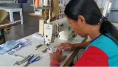  ??  ?? Sewing trainee