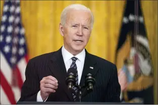  ?? ANDREW HARNIK — THE ASSOCIATED PRESS, FILE ?? President Joe Biden is looking to set his sights higher in the nationwide vaccinatio­n effort. He might double his original goal for vaccinatio­ns in his first 100days in office.