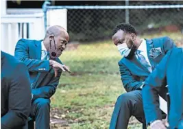  ?? RON HARRIS/AP ?? S. Lee Merritt, right, and Chris Stewart, attorneys for Ahmaud Arbery’s mother, confer Tuesday in Georgia. Arbery was killed Feb. 23 by a white father and son.