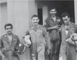  ??  ?? No.4 Squadron pilots before a mission: (left to right) Balasubram­aniam,