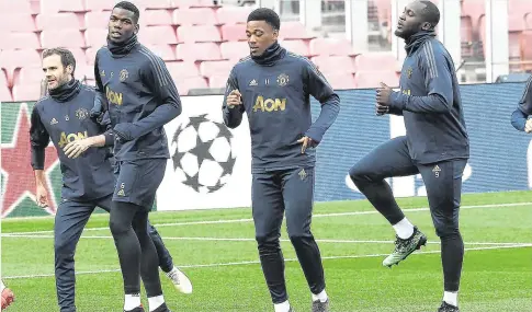  ??  ?? Juan Mata, Paul Pogba, Anthony Martial and Romelu Lukaku warm up at the Nou Camp ahead of tonight’s showdown with Barcelona