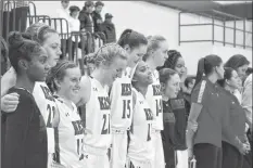  ?? COLIN CHISHOLM ?? The KES prep girls basketball team lines up prior to their first home game in Windsor