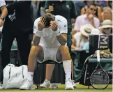  ?? ALASTAIR GRANT THE ASSOCIATED PRESS ?? Slovakia’s Martin Klizan retired Tuesday from his Wimbledon match against Servia’s Novak Djokovic. Klizan was struggling with a left leg problem that has bothered him for about two months.