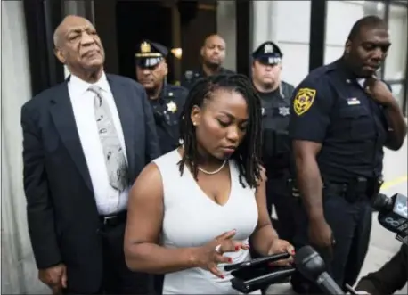  ?? ASSOCIATED PRESS ?? Bill Cosby listens to his wife Camille’s statement being read aloud by Ebonee M. Benson outside the Montgomery County Courthouse after a mistrial in his sexual assault case in Norristown on June 17.