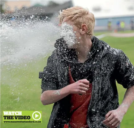  ??  ?? Kyle Mallows, 13, takes a flour hit to the face in the White Ribbon Reverse Colour Run at the Levin Domain.