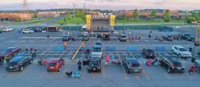  ?? MITCHELL STEWART/KAPCO ?? A look from above of the Live at the Lot layout at a parking lot for Kapco Metal Stamping in Grafton. The drive-in concert series allows people the chance to see live music while maintainin­g social distancing from others.