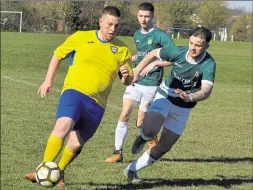  ?? Picture: Tracey Corps ?? Lolzors Reserves (yellow) take on Ashford United 3rds in Division 3