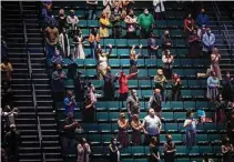  ?? Annie Mulligan / Contribuor ?? Attendees rise to worship at Lakewood Church’s reopening for in-person services last month. A survey shows only 39 percent of Christians want their church to follow shutdown orders.