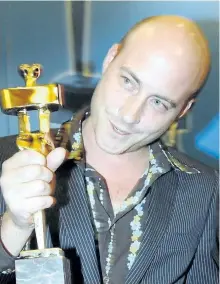  ??  ?? Patrice Vermette shows off award at the Genie Awards in Toronto in 2006. Vermette is nominated for an Oscar for his work on Arrival. Many people who worked on the film are up for awards, including Director Denis Villeneuve.