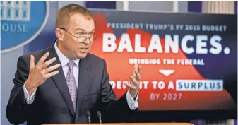  ?? ANDREWHARN­IK, AP ?? Budget DirectorMi­ck Mulvaney, speaking at a budget news briefing Tuesday, says President Trump’s proposal wouldn’t kick anyone off any federal program who really needs it.