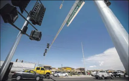  ?? Las Vegas Review-Journal file ?? A traffic light at Cimarron Road and Blue Diamond Road. The state Office of Traffic Safety is seeking to get the Legislatur­e to consider authorizin­g law enforcemen­t agents to use traffic camera footage as a basis for fining drivers for violations.