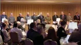  ?? JONATHAN TRESSLER — THE NEWS-HERALD ?? Several past Jorge Medina Distinguis­hed Service Award winners gather before the crowd Feb. 7 at the Lake County Blue Coats 52nd Annual dinner. Pictured from left are: William Crosier, Dale Flood, Jerry White, Daniel Llewellyn, Ronald Andolsek, Matthew...