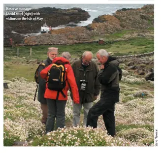 ??  ?? Reserve manager David Steel (right) with visitors on the Isle of May