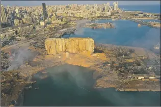  ?? (AP/Hussein Malla) ?? A drone picture shows the scene of an explosion Aug. 5 hitting the seaport of Beirut, Lebanon.