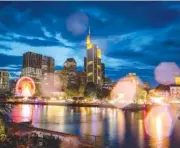  ?? AP PHOTO/MICHAEL PROBST ?? Raindrops on a camera lens reflect the lights of the Mainfest event Friday at the river Main in Frankfurt, Germany.