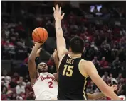  ?? SUE OGROCKI — THE ASSOCIATED PRESS ?? Ohio State guard Bruce Thornton shoots in front of Purdue center Zach Edey in the second half of Sunday’s game.