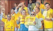  ??  ?? TMC MP Kalyan Banerjee (in blue) joins TDP lawmakers during a protest to demand special category status for Andhra Pradesh at Parliament on Thursday.