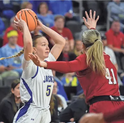  ?? PHOTOS BY SAMANTHA LAUREY / ARGUS LEADER ?? SDSU’s guard Ellie Colbeck (5) looks to pass the ball on Monday at Denny Sanford Premier Center in Sioux Falls.