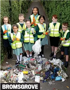  ?? ?? Job done: Meadows First School pupils with their haul