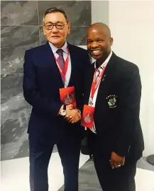  ?? Picture: SUPPLIED ?? FRESH START: Aiba president Gafur Rahimov is congratula­ted by Sanabo president Andile Mofu, right, after his election.
