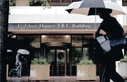  ??  ?? A pedestrian walks past the Federal Bureau of Investigat­ion headquarte­rs in Washington, DC. Draft legislatio­n partially restricts the FBI’s ability to access US data collected under Section 702 by requiring the agency to obtain a warrant when seeking...
