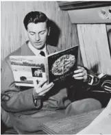  ??  ?? In this file photo taken on July 04, 1957 French fashion designer Hubert de Givenchy reads a magazine aboard a flight in Beauvais.