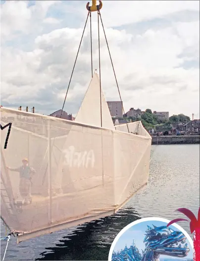  ??  ?? the bow as his paper boat is craned into Fife ahead of its launch on June 6, 1995