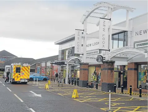  ??  ?? CLEAN UP: The man was taken to hospital after the glass fell – the second time a pane has fallen from a canopy in three days