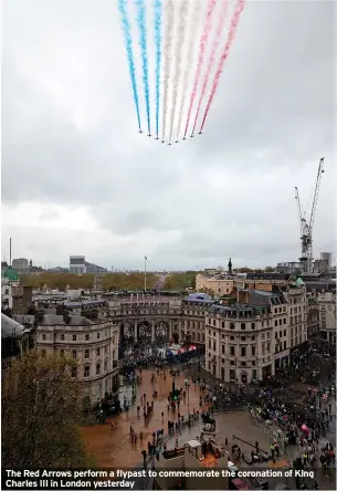  ?? ?? The Red Arrows perform a flypast to commemorat­e the coronation of King Charles III in London yesterday