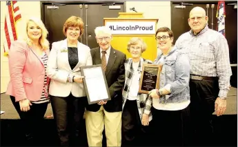  ?? LYNN KUTTER ENTERPRISE-LEADER ?? Bill and Marietta Morris, center, were awarded the Bud Cox Award on Friday night during the Lincoln Area Chamber of Commerce banquet. Presenting awards included chamber President Heather Keenen, left, state Rep. Charlene Fite, Bill and Marietta Morris,...