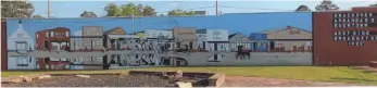  ?? (Courtesy of Max Taylor/Special to the News-Times) ?? A mural depicting Smackover in 1922 has been restored at Kennedy Park in downtown Smackover.