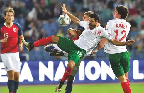  ??  ?? Hopeful... Bulgaria’s Galin Ivanov (no18) takes on Norway in the Nations League