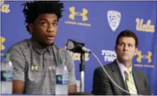  ?? JAE C. HONG — THE ASSOCIATED PRESS ?? UCLA head coach Steve Alford, right, listens as Jalen Hill reads his statement during a news conference at UCLA Wednesday in Los Angeles. Three UCLA basketball players accused of shopliftin­g in China admitted to the crime and apologized before Alford...