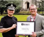  ??  ?? Award Chief Superinten­dent Roddy Irvine accepts Champions for Change Award from Nil By Mouth’s Dave Scott on behalf of Police Lanarkshir­e