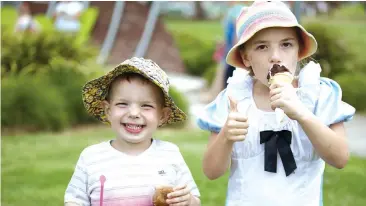  ??  ?? Bailey Cooper (left) and Prue Cleaver enjoy a treat during last years festival, which returns to Drouin on February 9.