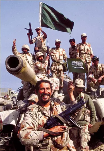  ?? Getty Images ?? Saudi troops (above) celebrate victory after the Battle of Khafji during the Gulf War.