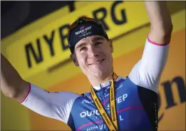  ?? DANIEL COLE – THE ASSOCIATED PRESS ?? Stage 2 winner Netherland­s’ Fabio Jakobsen celebrates on the podium following Saturday’s 125.8 mile trek from Roskilde to Nyborg, Denmark at the Tour de France.