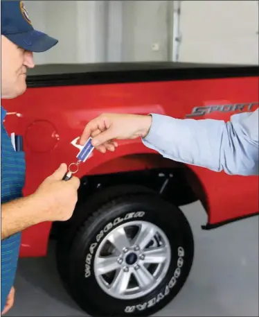  ??  ?? IN THIS file picture, a customer receives the keys to his new 2015 Ford F-150 Supercab 4x4 truck. The tussle between a Klerksdorp farmer, WesBank and an Autorama dealership has shone the spotlight on provisions of the Consumer Protection Act. | | KEITH SRAKOCIC AP