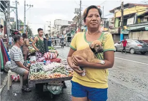  ?? HANNAH REYES MORALES THE NEW YORK TIMES ?? With rising food prices, Lilian Gomez says she is forced to stretch the rice she buys for her family.